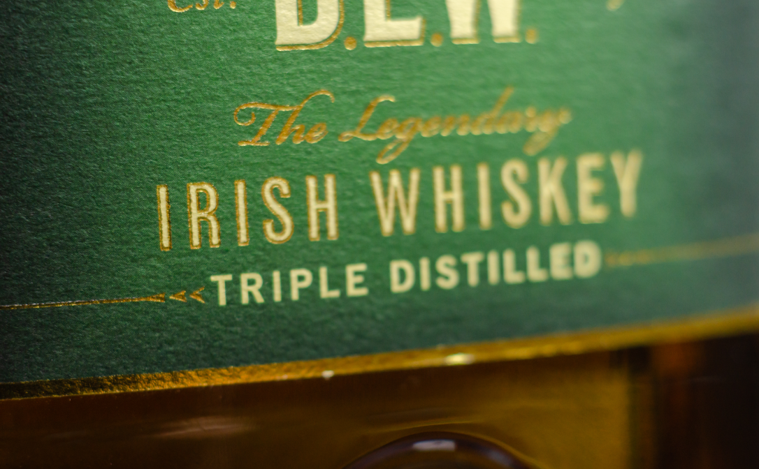 A green label with Irish Whiskey printed in gold